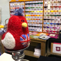 Red and White needle felted bird with union jack flag on chest